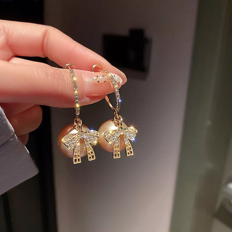 CHRISTMAS PEARL AND BOW EARRINGS-PINK-State of Style