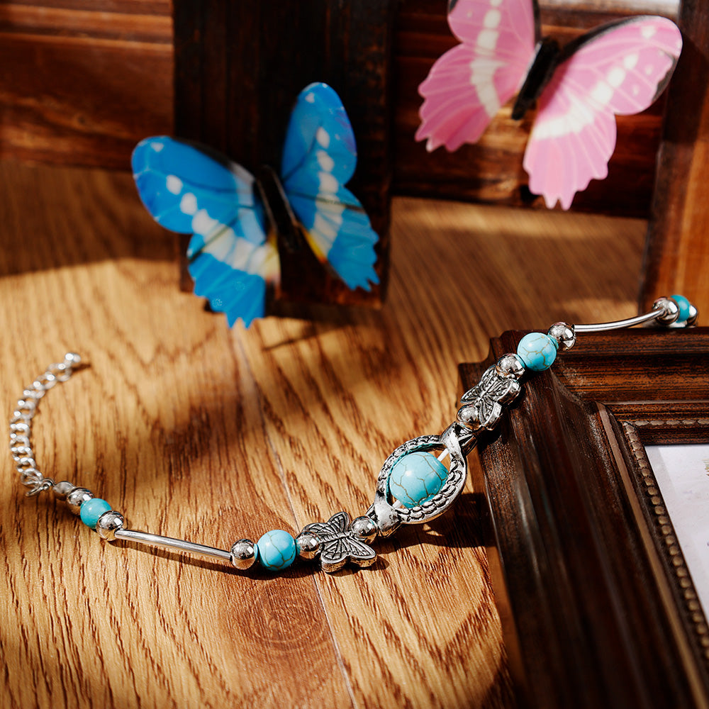 BUTTERFLY AND TURQUOISE BEAD BRACELET