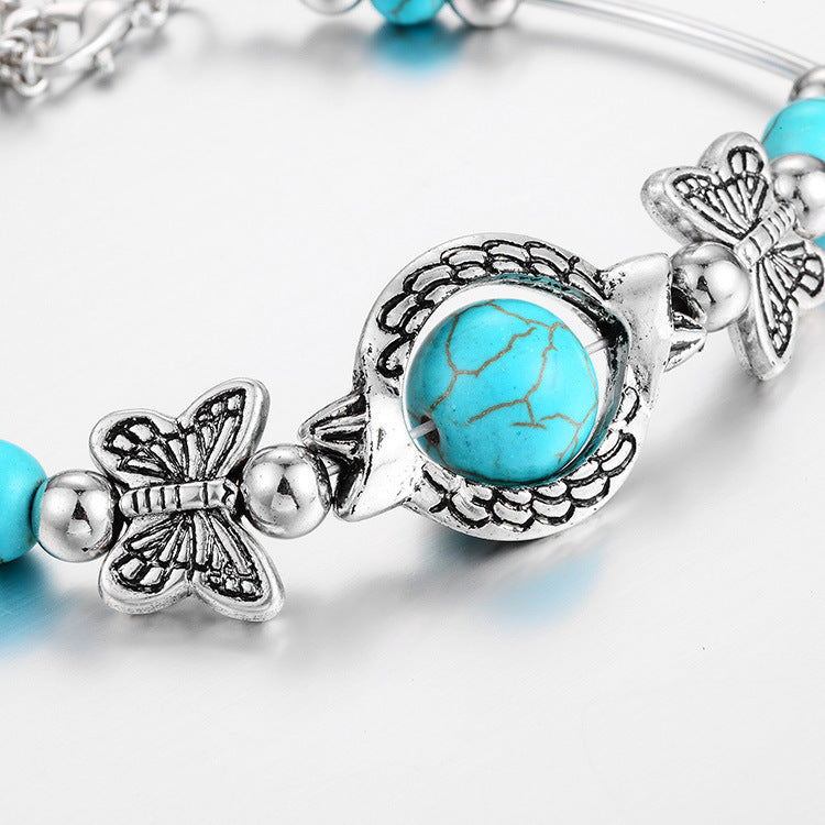 BUTTERFLY AND TURQUOISE BEAD BRACELET