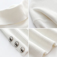 Buttoned women's turtleneck with stylish detail – Elara