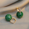 Elegant Luxury Earrings with Green Pearls