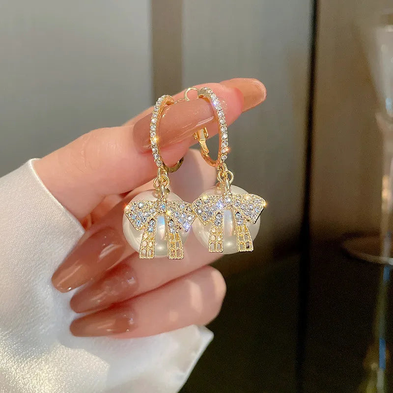 CHRISTMAS PEARL AND BOW EARRINGS-BEIGE-State of Style