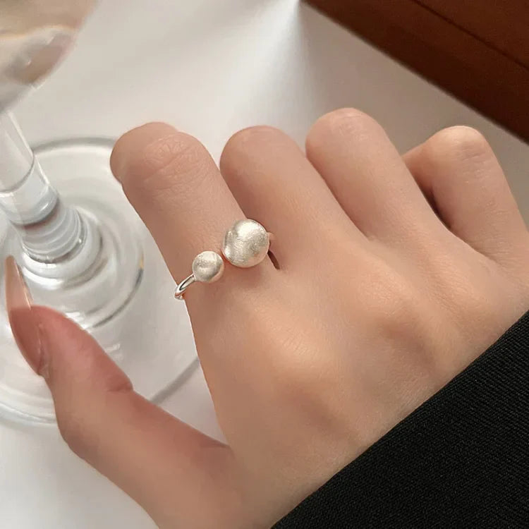 Brushed Silver Ring with Interlinked Pearls – Elara